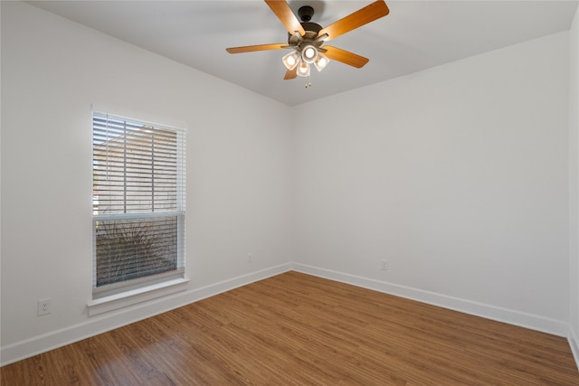 spare room featuring hardwood / wood-style floors and ceiling fan