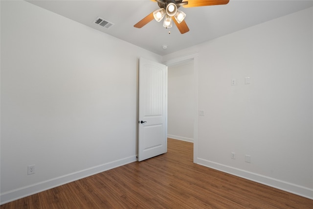 spare room with wood-type flooring and ceiling fan