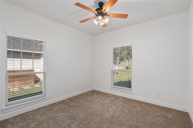 empty room featuring ceiling fan and carpet floors