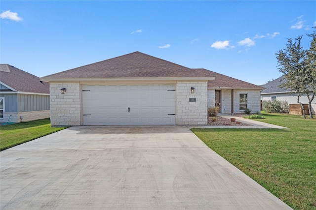 ranch-style home with a front lawn and a garage