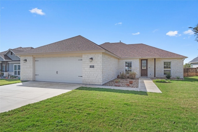 ranch-style home featuring a front lawn and a garage