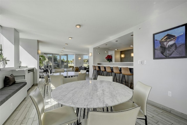 dining area with light hardwood / wood-style floors