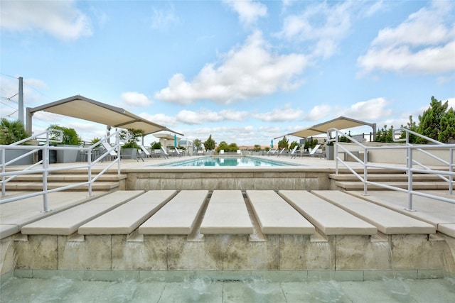 view of swimming pool featuring a patio area