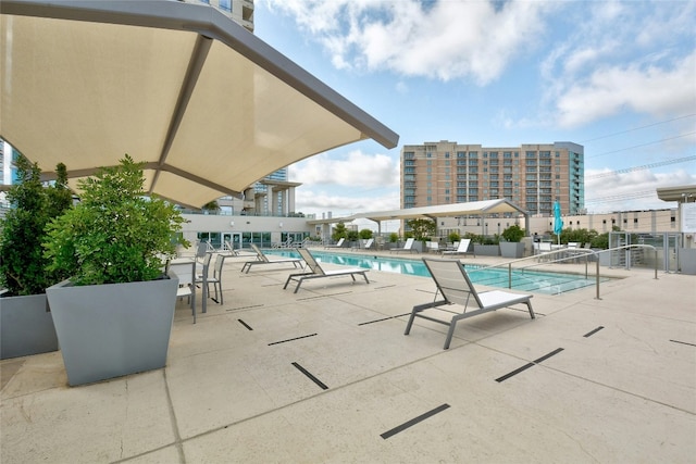 view of pool featuring a patio area