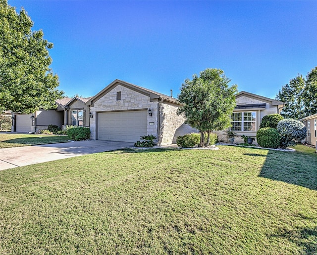 single story home with a garage and a front lawn