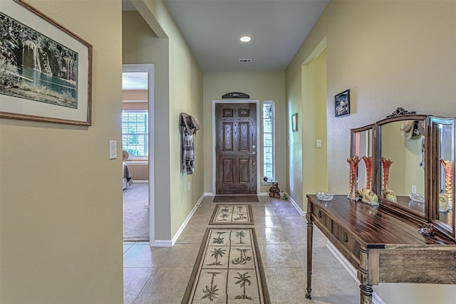 foyer with light tile patterned flooring