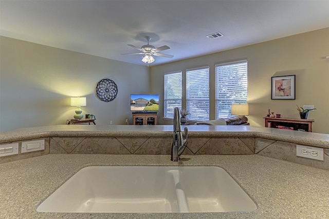 kitchen with ceiling fan and sink