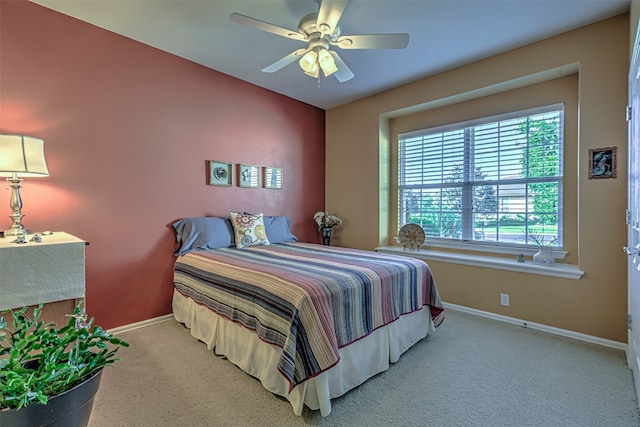 bedroom with light colored carpet and ceiling fan