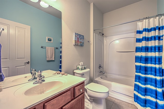 full bathroom featuring toilet, vanity, tile patterned floors, and shower / bath combo with shower curtain