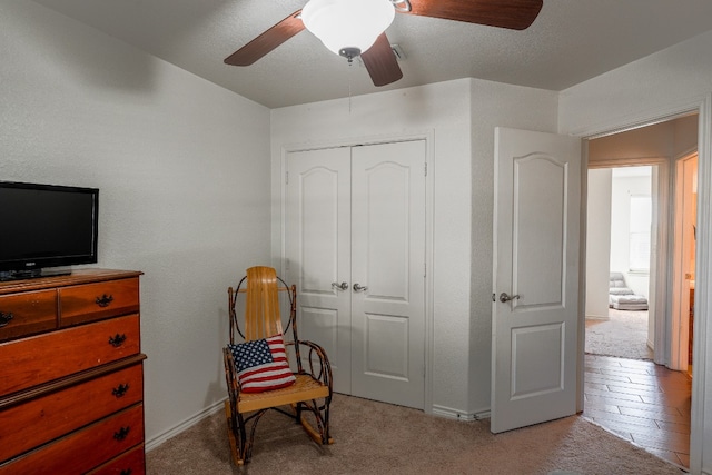 living area featuring light colored carpet