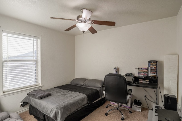 bedroom with light carpet and ceiling fan