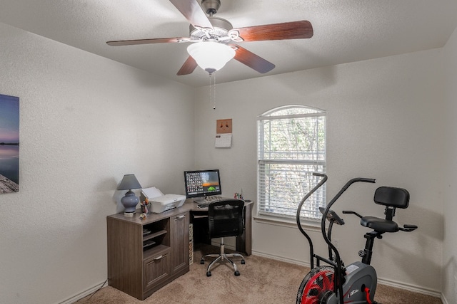 office area featuring ceiling fan and light colored carpet