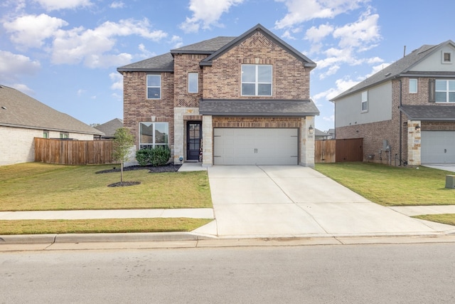 view of front of property featuring a front lawn and a garage