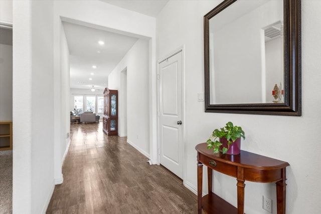 corridor featuring dark hardwood / wood-style floors