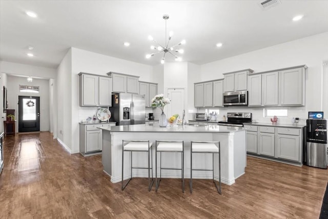 1440 Morning View Rd, Georgetown, TX 78628 - kitchen with stainless steel appliances, gray cabinetry, a chandelier, and recessed lighting