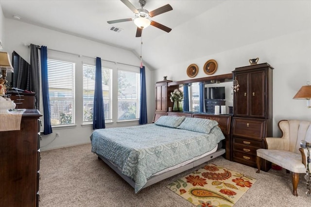 bedroom featuring light carpet, lofted ceiling, ceiling fan, and baseboards