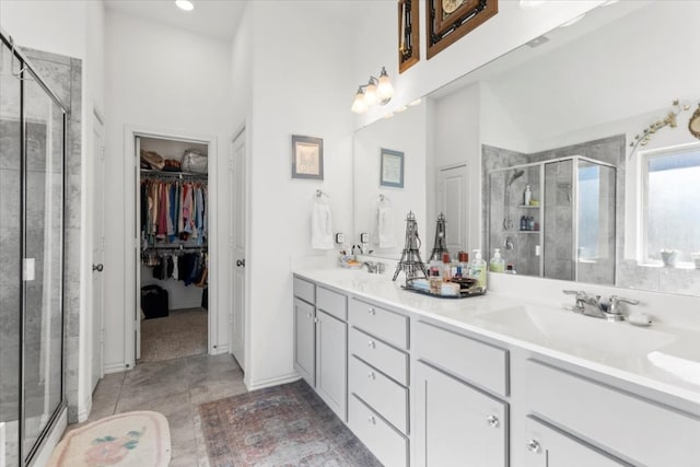 bathroom featuring tile patterned floors, vanity, high vaulted ceiling, and walk in shower