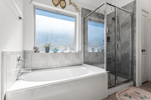 bathroom featuring separate shower and tub and tile patterned floors