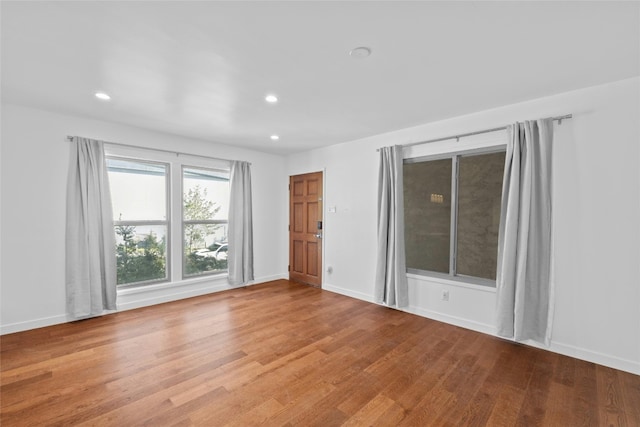 spare room with light hardwood / wood-style flooring