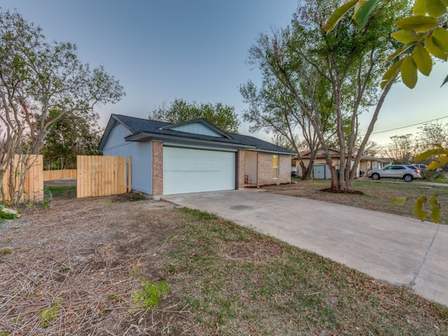 ranch-style home featuring a garage