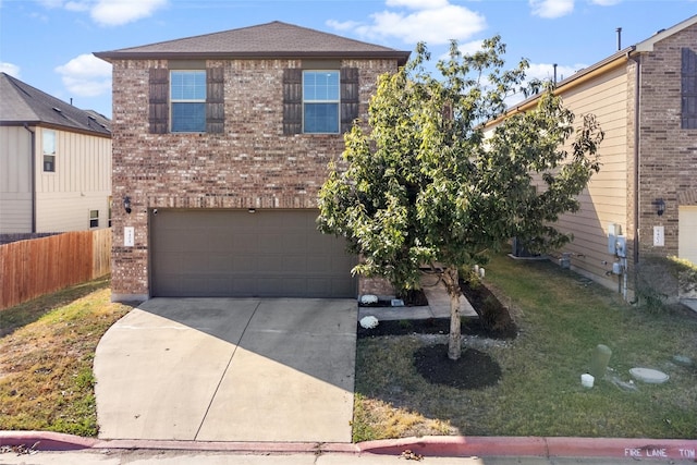 view of front of home with a garage and a front yard