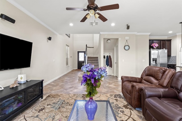 living room featuring ceiling fan and ornamental molding