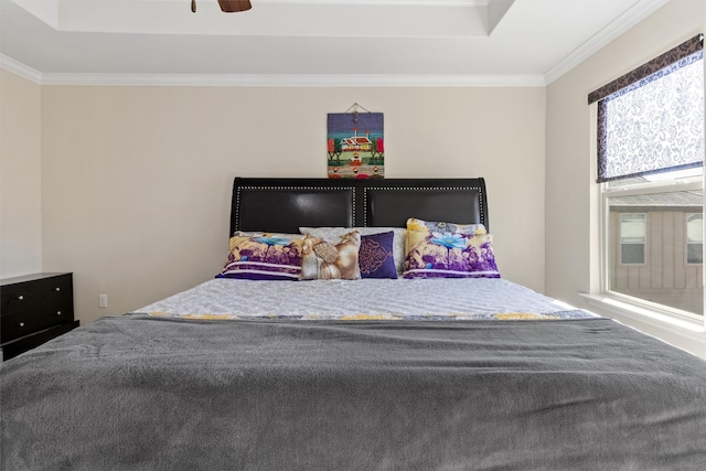 bedroom with multiple windows, crown molding, and ceiling fan