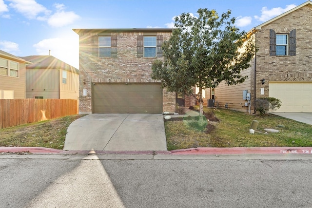 front of property featuring a garage and cooling unit