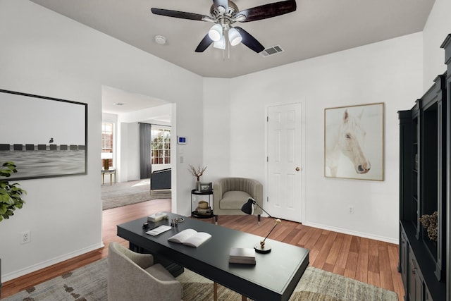 office space featuring hardwood / wood-style flooring and ceiling fan