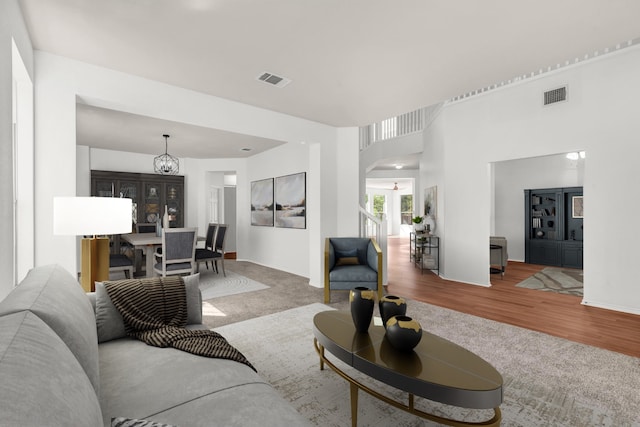 living room featuring hardwood / wood-style floors and a notable chandelier