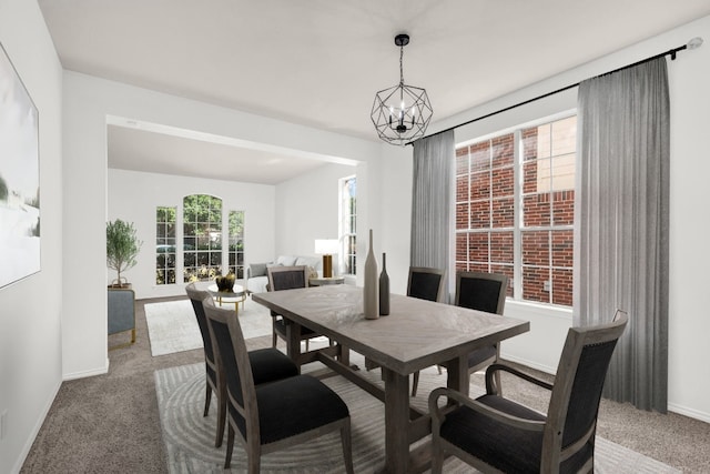 dining space featuring an inviting chandelier and carpet flooring