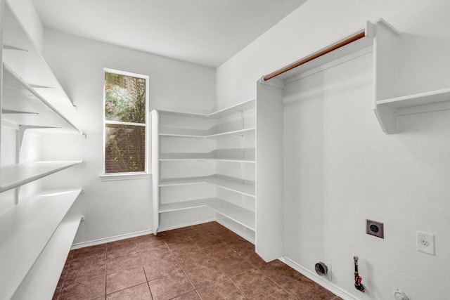 spacious closet with tile patterned floors