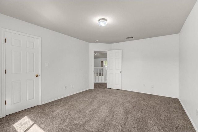 spare room with carpet flooring