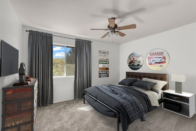 bedroom featuring light colored carpet and ceiling fan