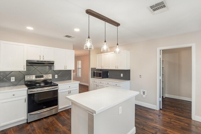 kitchen featuring white cabinets, dark hardwood / wood-style floors, pendant lighting, and appliances with stainless steel finishes