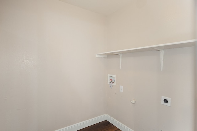 laundry room featuring hookup for a washing machine, dark hardwood / wood-style floors, and hookup for an electric dryer