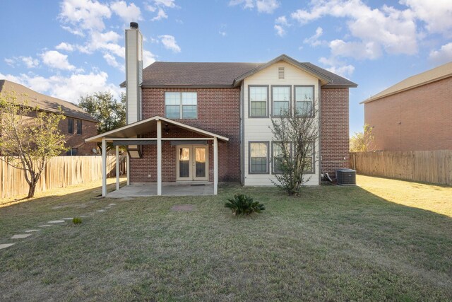 rear view of property with a patio area and a yard