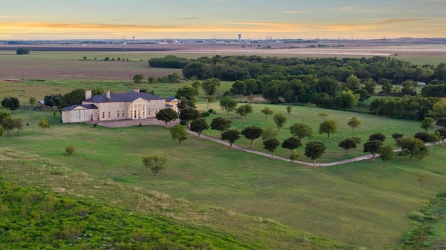 aerial view at dusk featuring a rural view