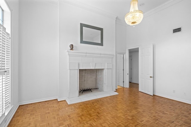 unfurnished living room featuring parquet floors, a high ceiling, a notable chandelier, crown molding, and a tiled fireplace