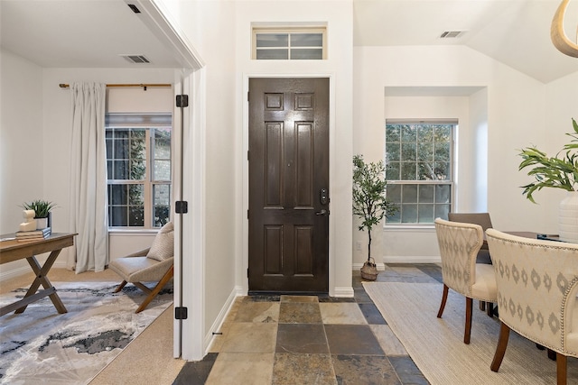 entryway featuring lofted ceiling