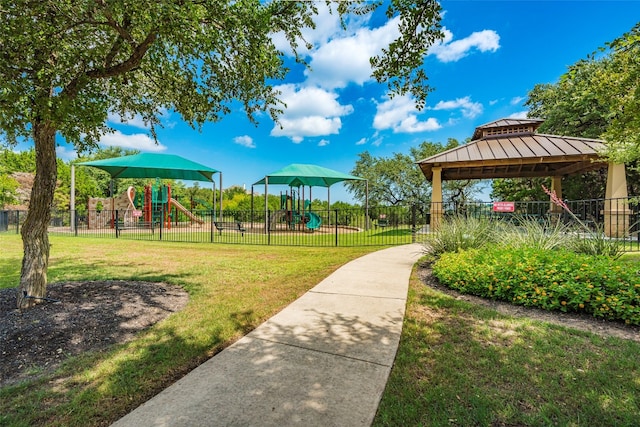 view of home's community featuring a gazebo, a playground, and a lawn