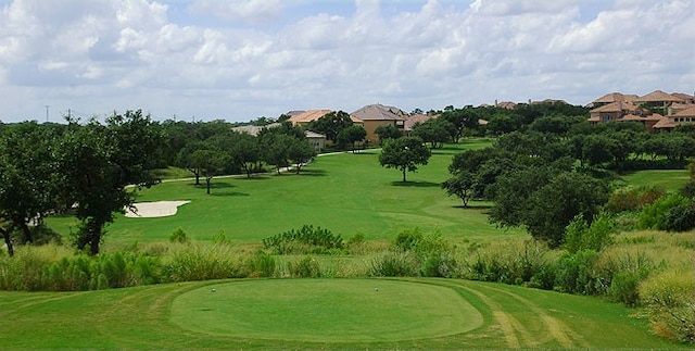 view of home's community with a lawn