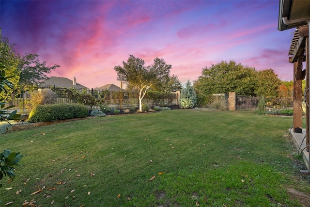 view of yard at dusk