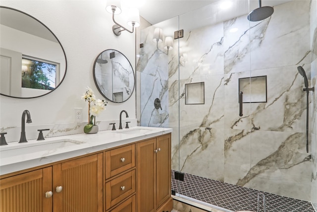 bathroom with vanity and an enclosed shower