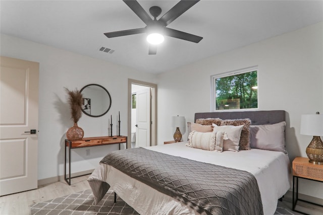 bedroom with ceiling fan and light wood-type flooring