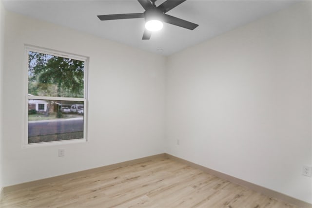 unfurnished room featuring ceiling fan and light wood-type flooring