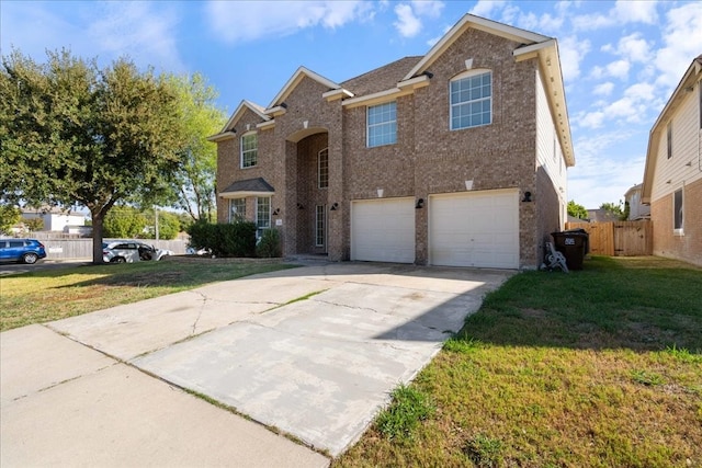 front of property featuring a garage and a front lawn