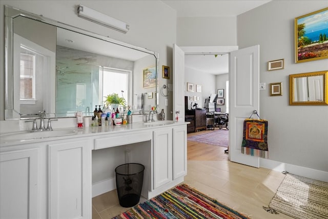 bathroom with vanity and hardwood / wood-style floors