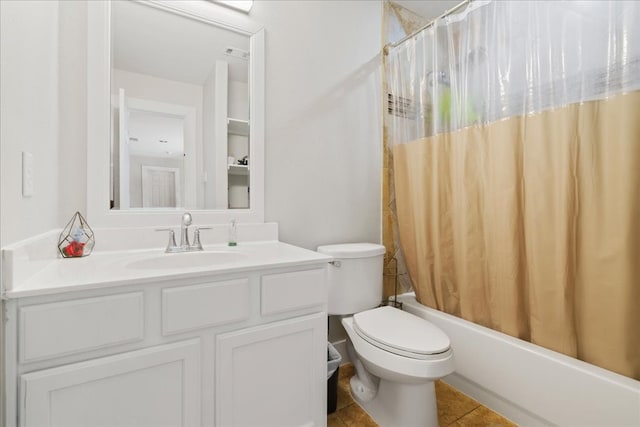 full bathroom with tile patterned flooring, shower / bath combo, vanity, and toilet