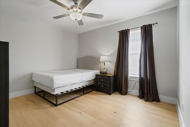 bedroom featuring ceiling fan and light hardwood / wood-style floors